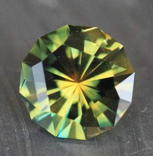 A brilliant-cut green and gold Australian sapphire